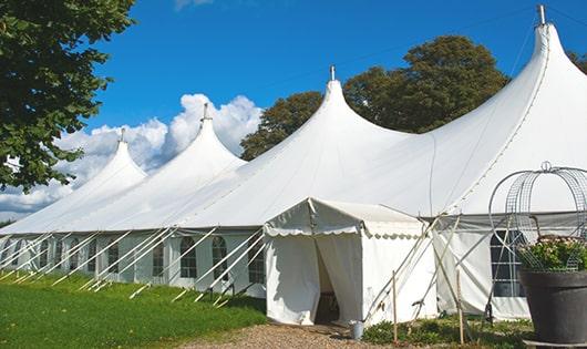 a row of portable restrooms at an outdoor festival, providing comfort and sanitation for attendees in Constantia